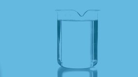 Animation of percent growing over laboratory beaker on blue background. Global science, research, computing and data processing concept digitally generated video.