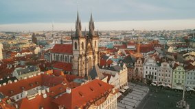 Aerial Drone. Beautiful Ancient Gothic Church in the Square in Prague Old City. Awesome View of the Antique Traditional Praha Houses. Traveling and Tourism in Europe Concept