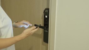 Hand using smartwatch for open digital door lock at home or apartment. NFC Technology, Fingerprint scan, keycard, PIN number, smartphone, electrical and contactless lifestyle concepts - Powered by Shutterstock - Get 15% off with code: PIKWIZARD15