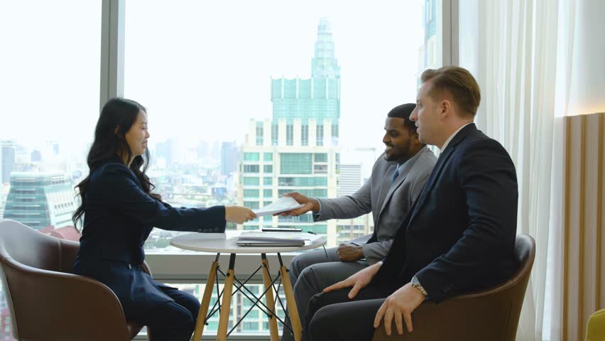 Two african american male hr specialist manager, employer, boss talking to female asian candidate at job interview, consulting client at office meeting. Hiring and employment, recruitment concept