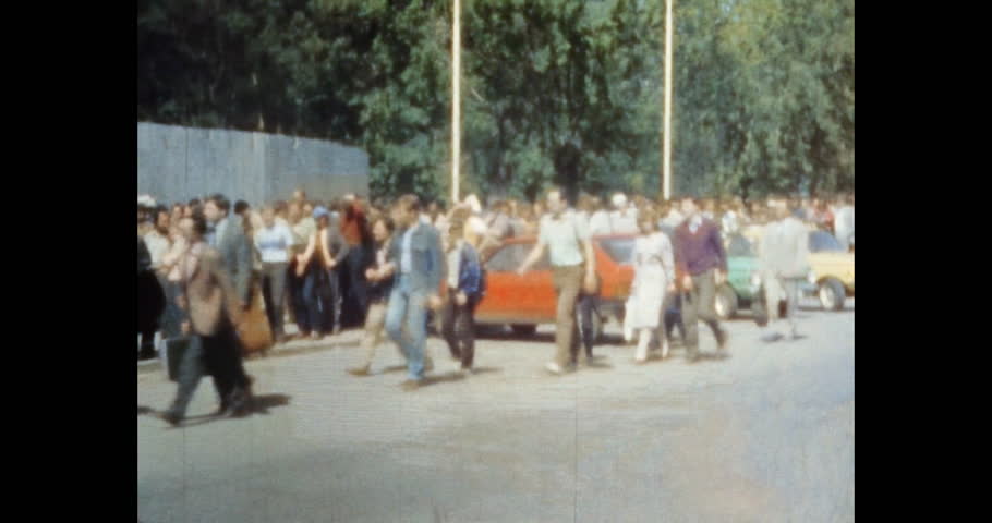 Busy people crowd walking on summer city street. People walk, move in urban outdoors. Crowded traffic in urban rush hour. city life. Archival vintage color film. Old retro archive 1980s Moscow, Russia Royalty-Free Stock Footage #1105922357