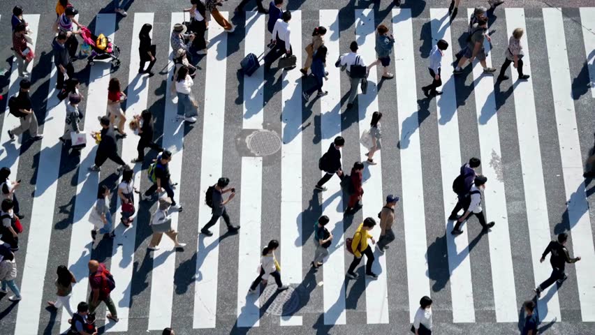 Busy Pedestrian Street crowd. people walking on around city square view from the top aerial shoot