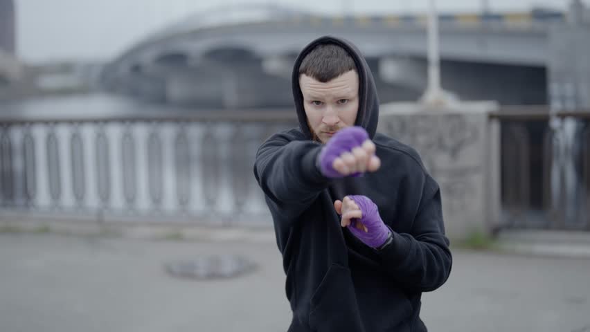 Healthy lifestyle - male boxer exercising in the city | Shutterstock HD Video #1105924073