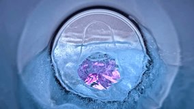 View inside of metal jar in soda can on blue water or liquid is poured out in super macro slow motion 1000fps. Pov view inside empty can in red background in close up. Super macro slow motion 1000fps - Powered by Shutterstock - Get 15% off with code: PIKWIZARD15
