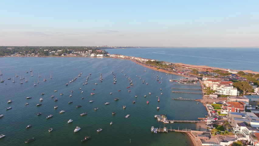 Poole, UK: Aerial view of city in England, famous seaside resort by Atlantic Ocean, Sandbanks Beach in summer at sunset - landscape panorama of United Kingdom from above