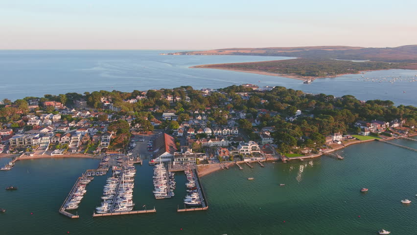 Poole, UK: Aerial view of city in England, seaside resort with famous Beaches by Atlantic Ocean, Sandbanks neighbourhood in summer at sunset - landscape panorama of United Kingdom from above