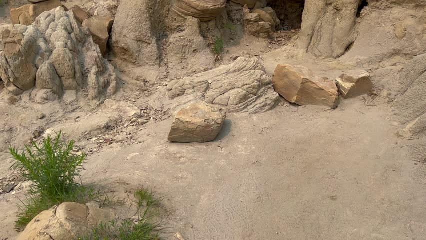 Panning up on the badlands hills and mountains in the Cannonballs area in the North Unit in  Theodore Roosevelt National Park in North Dakota.