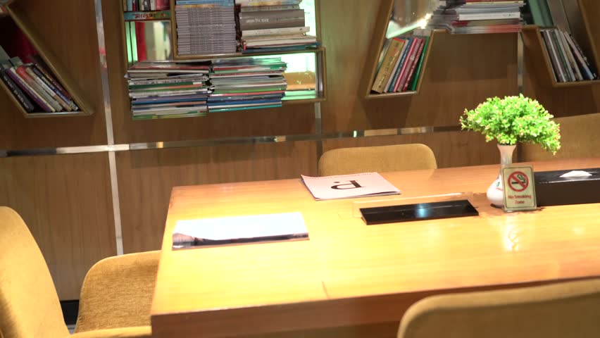 man checking documents in reading room . 