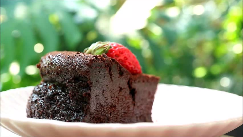 Footage of Fork Scooping Moist and Dense Texture of Flavorful Flourless Chocolate Cake