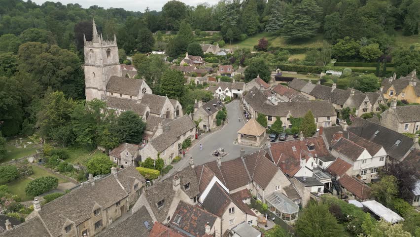 Aerial view of the English village of Castle Combe in the Cotswolds, Wiltshire, England Royalty-Free Stock Footage #1105940885