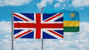 Republic of Rwanda and United Kingdom, UK flag waving together in the wind on blue sky, cycle looped video, two country cooperation concept