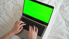 Close up smart caucasian teenage girl female hands using laptop green screen Chroma Key. Woman typing on the keyboard using touchscreen. Online shopping, browsing internet, messaging, social media