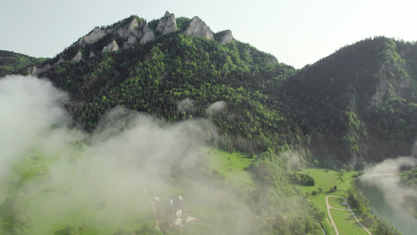 Aerial view of Trzy Korony mountain in Pieniny in summer, Poland. Landscape of the beautiful peak Three Crowns with morning fog and mountain river on the Slovakia - Poland border
