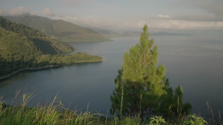 Danau Toba view from Tarabunga Hill - a Large Natural Lake in North Sumatra, Indonesia, Occupying The Caldera of a Supervolcano Royalty-Free Stock Footage #1105952391