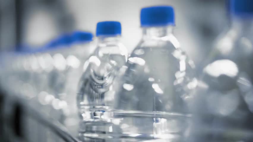 Close Up Of Mineral water Bottle In A Production Line Concept Technology manufacturing industrial Royalty-Free Stock Footage #1105956309