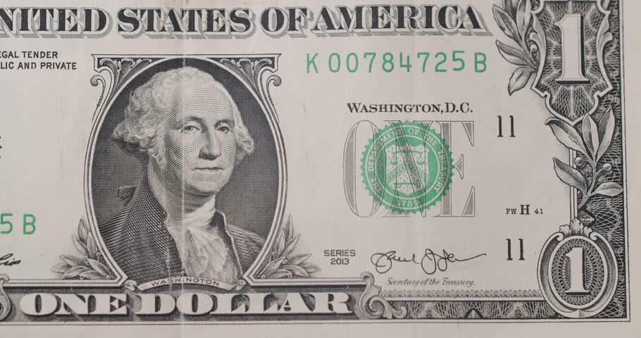 US President Washington on United States. American one dollar paper banknote in close up macro. One USD cash macro view. 1 Dollar Cash Stop Motion. 1 Dollar Closeup. Stop Motion of 1 USD Bills. Royalty-Free Stock Footage #1105957779