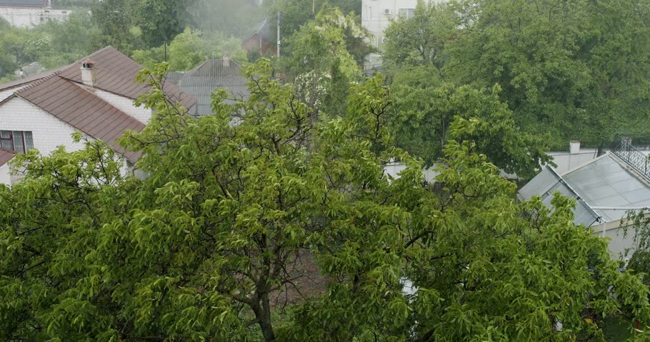Torrential Rainstorm With Hail In Urban Residential Street Raining Ice Storm, Torrential Hailstone Rain on Window, Inundation, Flooding, Rainfall, Natural Calamity Disaster Heavy Rainy Day.