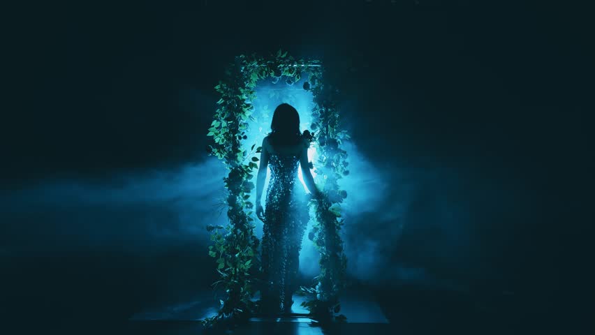 dark silhouette fantasy woman witch dancing in black night garden fog arch flowers nature, art neon blue magic light. Mystery forest nymph. lady dancer Gothic Girl vampire in smoke back rear view. 4k
