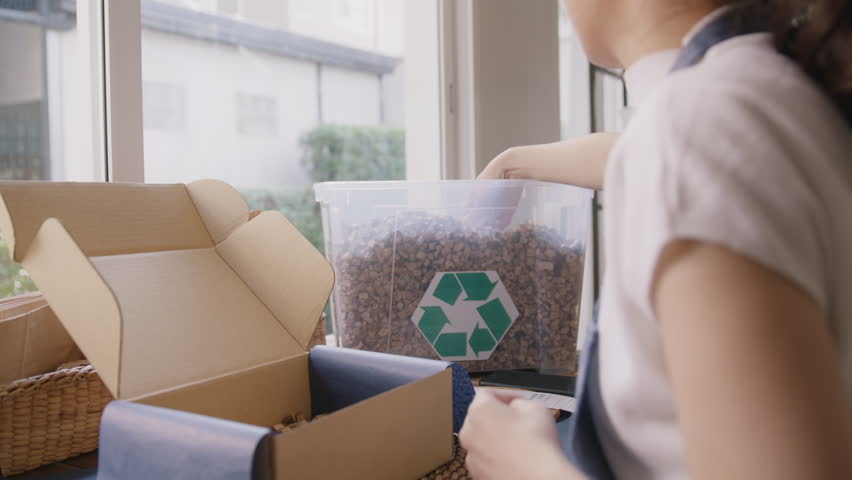 Eco friendly go green packaging parcel carton box in net zero waste store asian seller retail shop. Save the planet earth care ESG small SME owner asia people wrap reuse paper pack gift reduce garbage Royalty-Free Stock Footage #1105961939