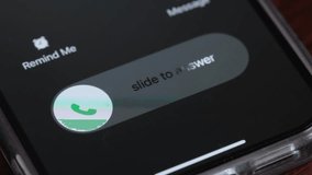 Macro video of an incoming call on a mobile phone. Pick up or reject a call on your smartphone - Powered by Shutterstock - Get 15% off with code: PIKWIZARD15