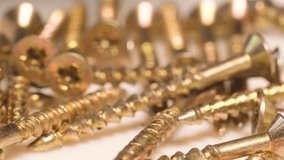 Macro video of falling metal bolts in slow motion. Many metal self-tapping screws for wood - Powered by Shutterstock - Get 15% off with code: PIKWIZARD15