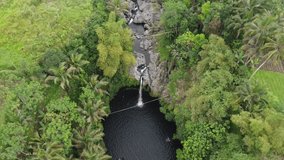 The drone view of Duwur Waterfall in Purbalingga, Central Java, Indonesia. This aerial video was taken on September 18, 2021 by a professional. This video contains view of a waterfall in tropical