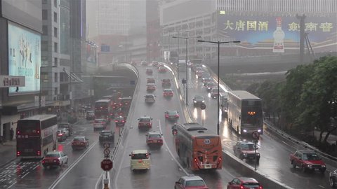 HONG KONG, SAR CHINA - AUGUST 2015:The traffic and buildings in Hong Kong during the rainy season. 
