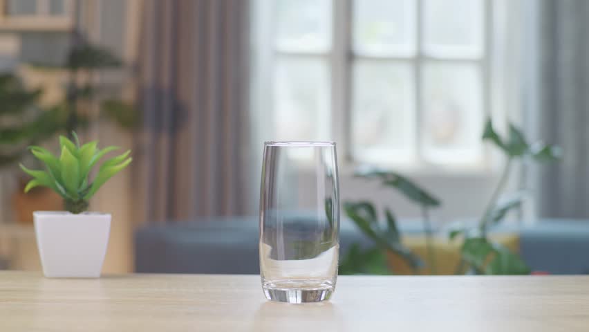 Orange Juice Being Poured Into A Glass On The Table At Home
 Royalty-Free Stock Footage #1105969777