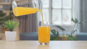 Orange Juice Being Poured Into A Glass On The Table At Home
 - Powered by Shutterstock - Get 15% off with code: PIKWIZARD15