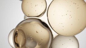 Cosmetics golden serum liquid bubbles abstract background. Cosmetic moisturizer essence gel. Collagen fluid bubble molecule. Moisturizing cream or oil for personal health care and beauty skin concept - Powered by Shutterstock - Get 15% off with code: PIKWIZARD15