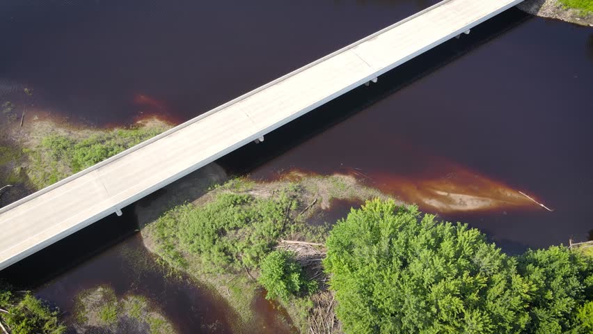Flying over a river and forest in Northern Minnesota near the border of Canada
