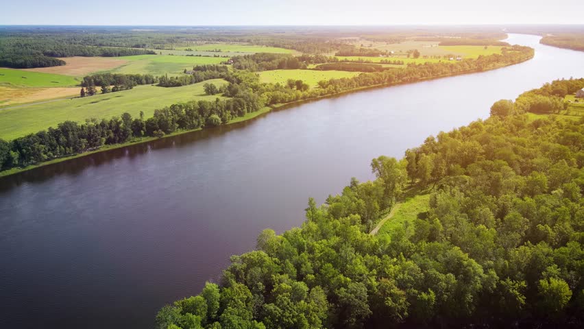 Flying over Rainy River that is the border between Canada and the United States in Northern Minnesota. Upper part is Canada.