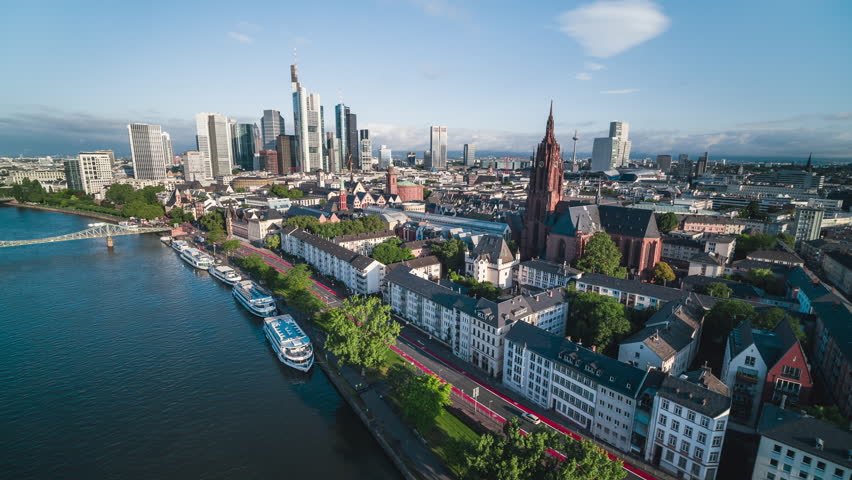 Establishing Aerial View Shot of Frankfurt am Main De, financial capital of Europe, Hesse, Germany, beautiful sunny day, city center, Frankfurt Cathedral, track along river Royalty-Free Stock Footage #1105980773