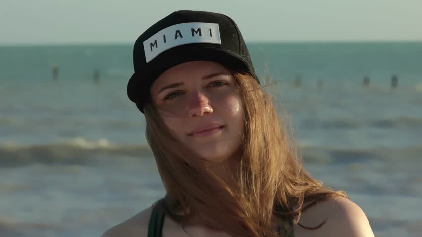 Beautiful girl at Miami Beach on a windy day in extreme slow motion - Miami Florida travel photography 