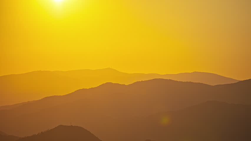 Orange sunset over mount Olympus on the island of Cyprus. Time lapse