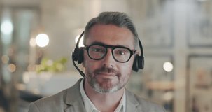 Face, video call and customer service with a business man talking during a webinar for online education. Portrait, crm and tutorial with a consultant using a headset in a virtual chat for assistance