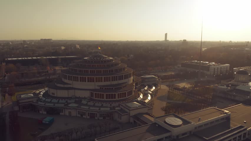 Centennial Hall in Wroclaw, Poland. Aerial footage, Drone shots, Architectural marvel, UNESCO World Heritage Site, Historic landmark, Modernist architecture, Max Berg, Symmetrical, Hala stulecia Royalty-Free Stock Footage #1105987591