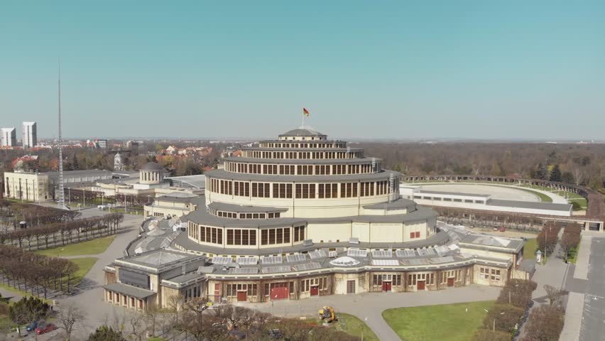 Centennial Hall in Wroclaw, Poland. Aerial footage, Drone shots, Architectural marvel, UNESCO World Heritage Site, Historic landmark, Modernist architecture, Max Berg, Symmetrical, Hala stulecia Royalty-Free Stock Footage #1105987607