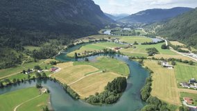 Drone aerial view: Agricultural fields on a river bank in Norway