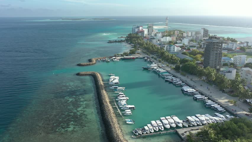 Drone photo of waves. The Maldives on a sunny day