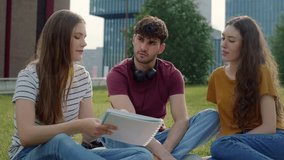Group of caucasian students studying outside the university campus. Shot with RED helium camera in 8K.   - Powered by Shutterstock - Get 15% off with code: PIKWIZARD15