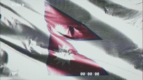 VHS video casette record Nepal flag waving on the wind. Glitch noise with time counter recording Nepali banner swaying on the breeze. Seamless loop.

