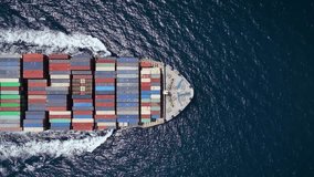 Aerial top down tracking of a large industrial container cargo ship crossing the sea with speed - Powered by Shutterstock - Get 15% off with code: PIKWIZARD15
