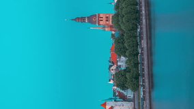 Riga, Latvia, Europe. Hyperlapse Cityscape Skyline In Evening Time. Night View Of Castle, Dome Cathedral And St. Peter's Church. Unesco World Heritage Site. Vertical Footage Video Of Popular Place.