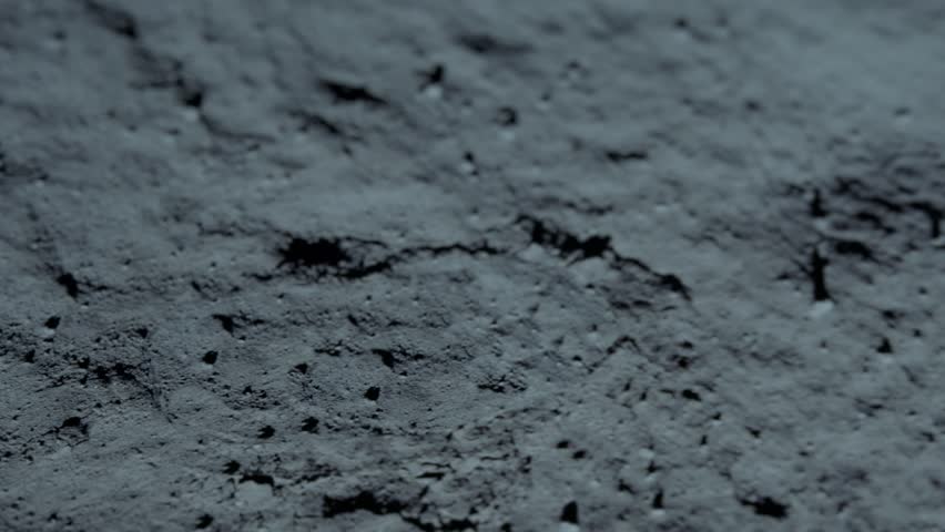 Lunar astronaut walking on the moon's surface and leaves a footprint in the lunar soil. 3d rendering. Some Elements of this video furnished by NASA. Royalty-Free Stock Footage #1106007425