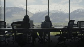 Slow motion of businesswomen talking in conference room with scenic view, pleasant grove, utah, united states