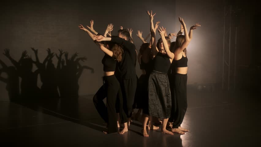 Silhouette of contemporary ballet dancers. Artists form a tree of people in the dance.
