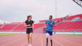 Asian athlete with prosthetic blades and trainer workout in stadium. Attractive amputee male runner and young sportswoman feel happy and enjoy practicing workout for Paralympics running competition. - Powered by Shutterstock - Get 15% off with code: PIKWIZARD15