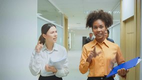 Professional businesswoman talking while stand on corridor in office. Attractive two female employee worker feel happy and enjoy spending leisure time together having discussion in corporate workplace - Powered by Shutterstock - Get 15% off with code: PIKWIZARD15