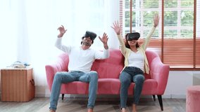 young couple having fun playing video games with virtual reality glasses at home - Powered by Shutterstock - Get 15% off with code: PIKWIZARD15